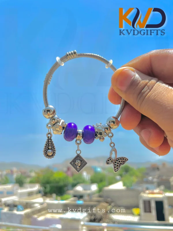 Elegant Silver Charm Bracelet with Purple Beads and Dangling Charms