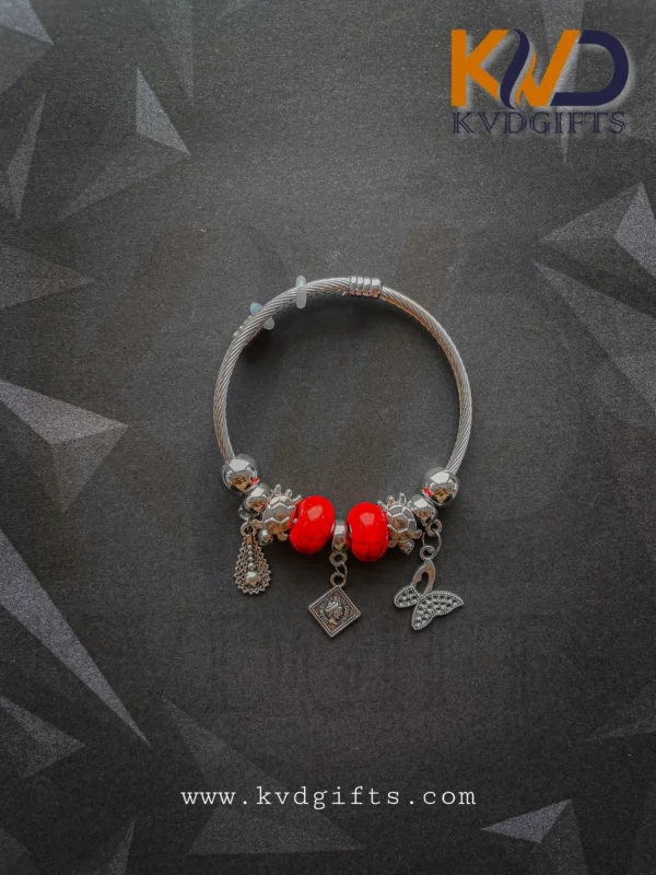 Elegant Silver Charm Bracelet with Red Beads and Dangling Charms
