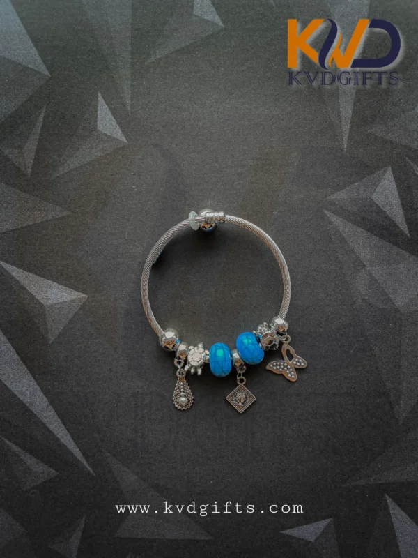 Elegant Silver Charm Bracelet with Sky Blue Beads and Dangling Charms