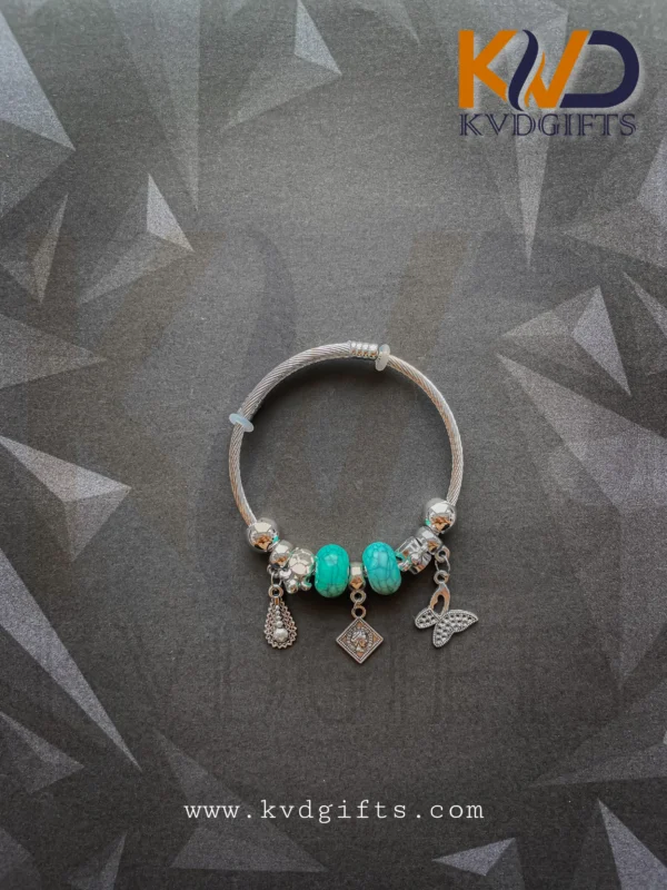 Elegant Silver Charm Bracelet with Sky Blue Beads and Dangling Charms