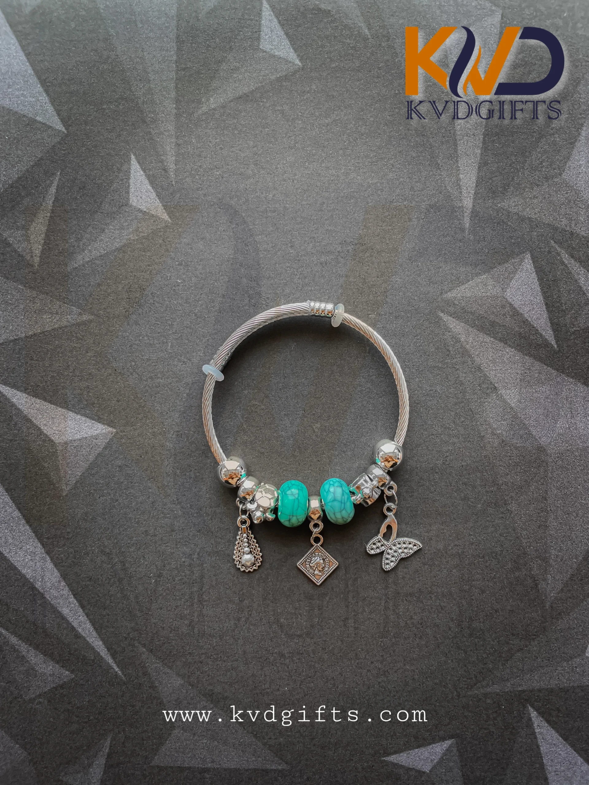Elegant Silver Charm Bracelet with Sky Blue Beads and Dangling Charms